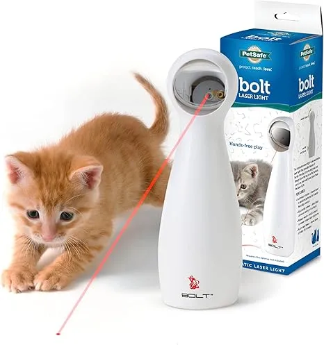 The FroliCat Bolt Interactive Laser Toy with a cat playing beside it