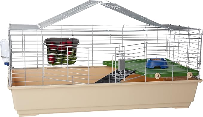 Beige small animal cage with wire top and house-shaped roof, equipped with hideaway, ramp, platform, food bowl, and water bottle for guinea pigs or rabbits